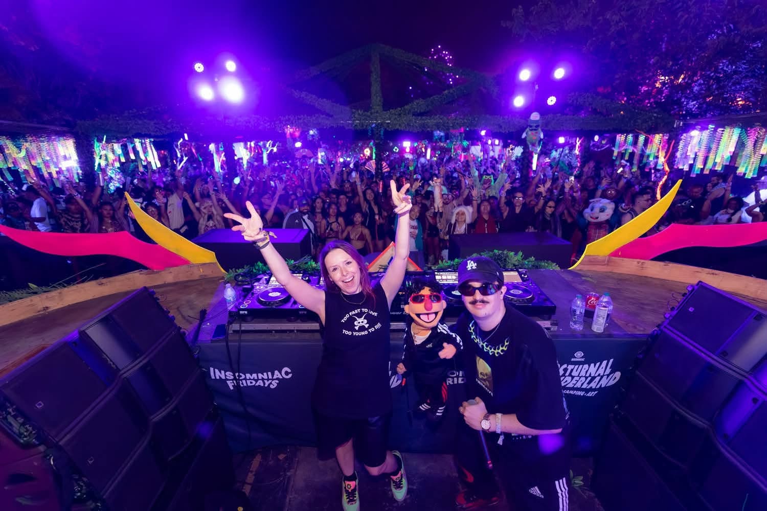 Reid Speed and LMNOP on stage at Nocturnal Wonderland with the crowd behind them